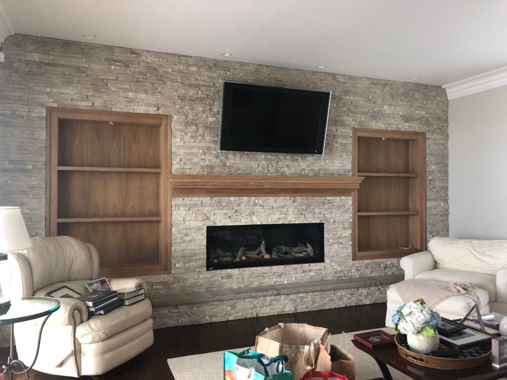 wood bookcases, styling shelvies,bookcases on both sides of a fireplace