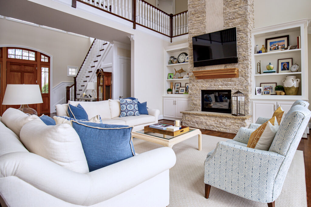 lake house two story living room, tow story stacked stone fireplace