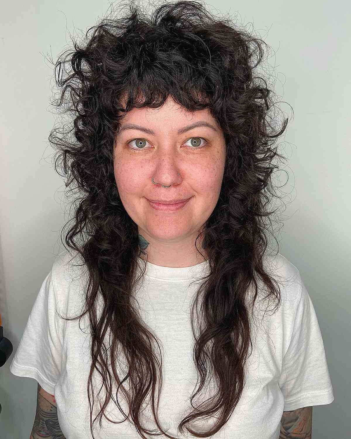 Long Shaggy Mullet with Choppy Layers for Curly-Haired Women